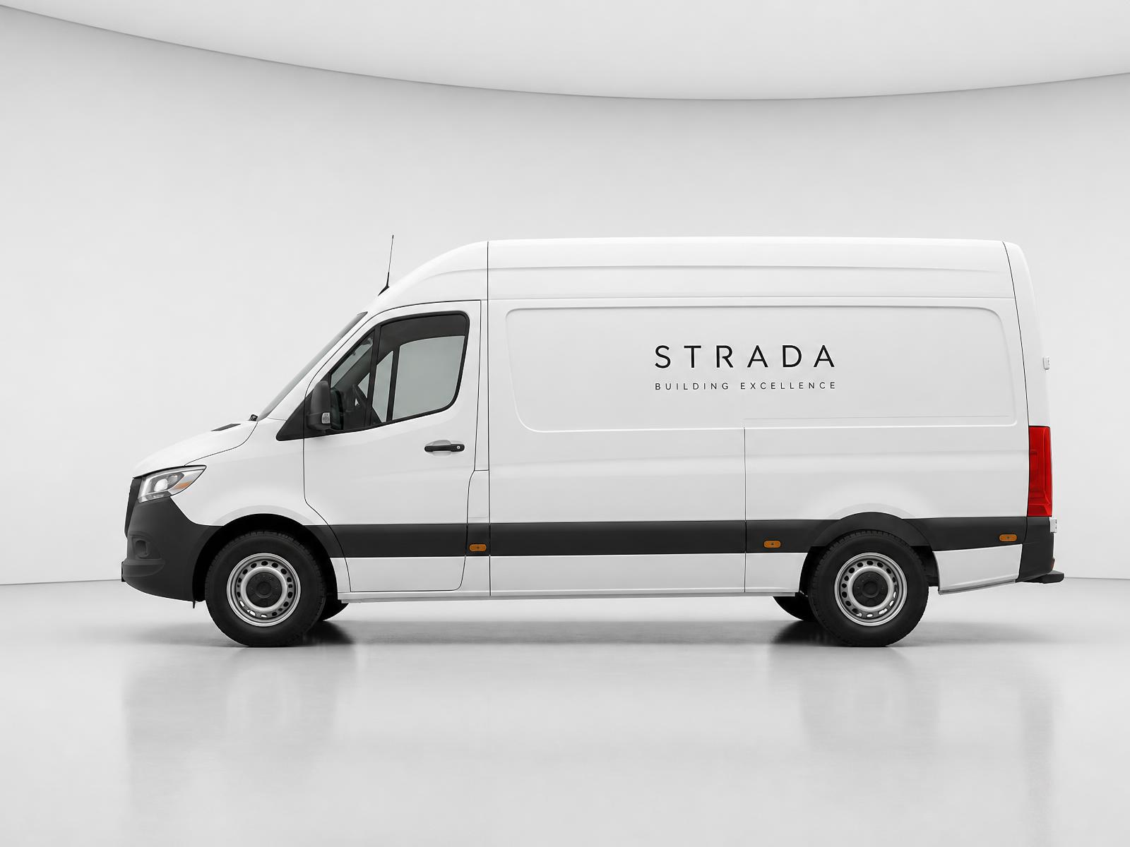 White commercial work van with a clean black wordmark on the side panel